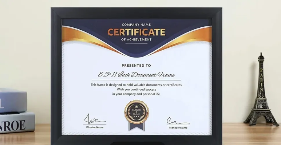 a certificate stored in a black wooden frame