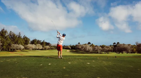 A man is playing golf on the golf course