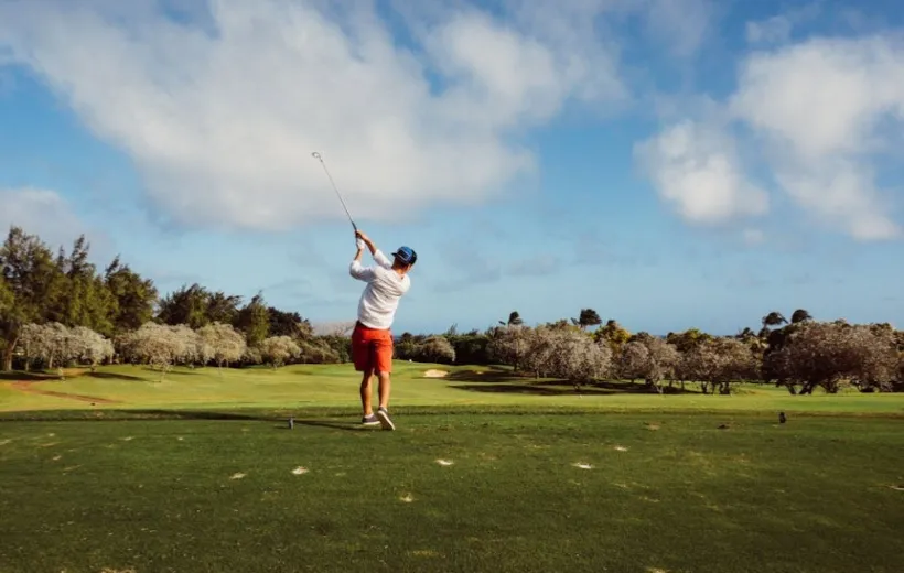 A man is playing golf on the golf course