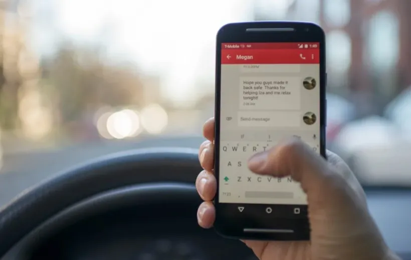 A person is messaging while in the car