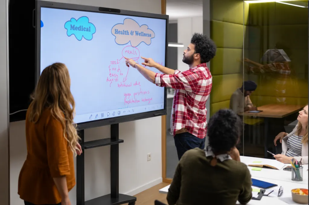 several students write on the NearHub Board Max at the same time