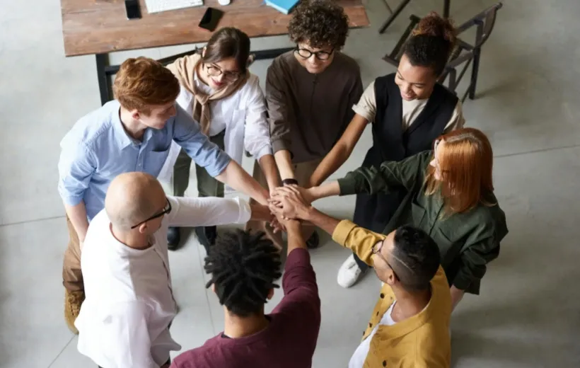 People started the morning standing meeting by holding hands together and cheering