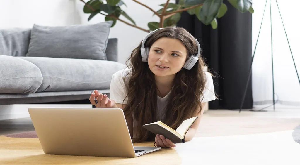 Woman wearing over-ear headphones while working at home.jpg
