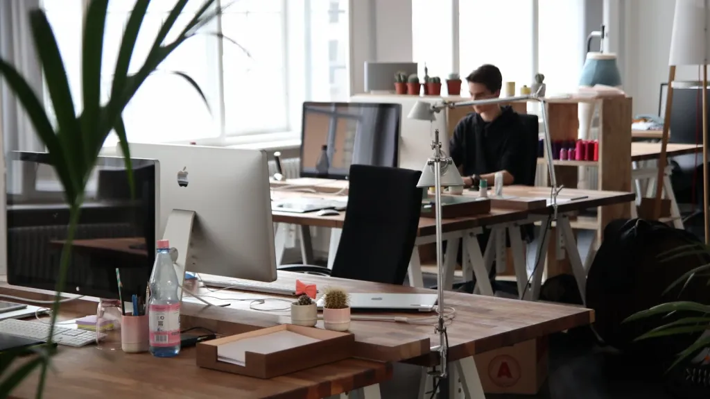 a man working alone in a large office.webp