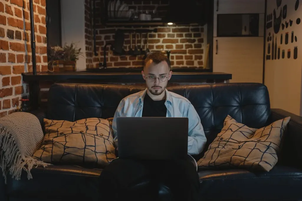 a man working at home with a laptop