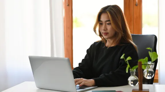 a-woman-sitting-before-a-computer.png