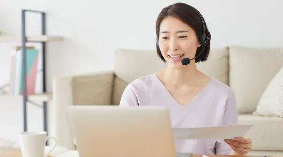 a-woman-using-bluetooth-headset-with-mic-for-remote-work