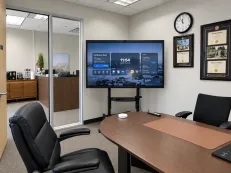All-in-one Zoom meeting room with integrated video conferencing display