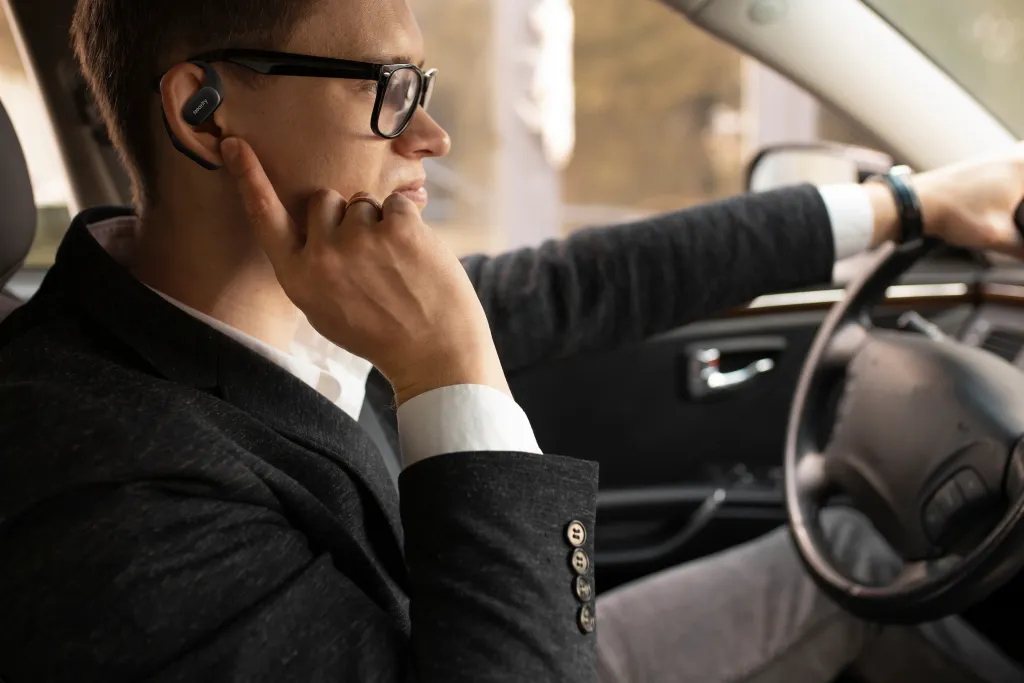 A man wearing the best earbuds for android when driving
