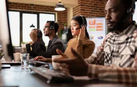 Three people are working using best earbuds for team calls
