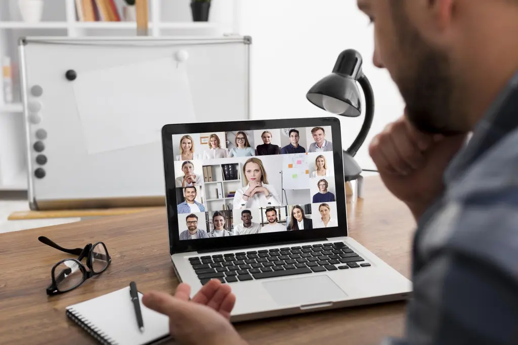 A person participating in an online Zoom meeting.