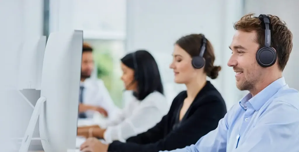 Call center professional utilizing a wireless contact center headset for clear communication and improved customer satisfaction.