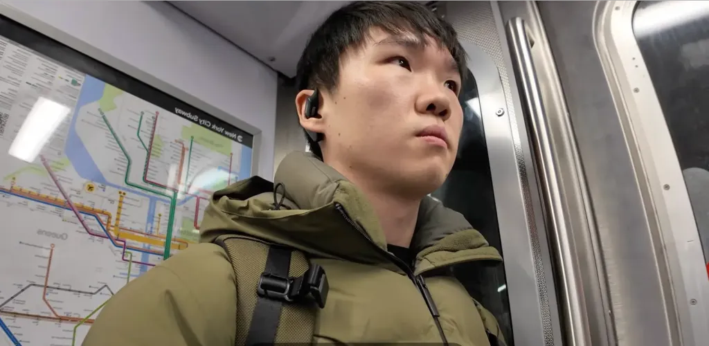 Jason wearing the Mempod Fit 2 while commuting on the NYC subway