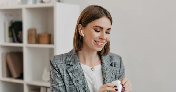 a woman wearing best headset for phone calls is talking