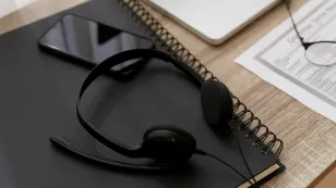 Professional wearing a Microsoft Teams headset during a video meeting in a hybrid work environment