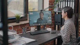 A woman using the best webcam for zoom when meeting.