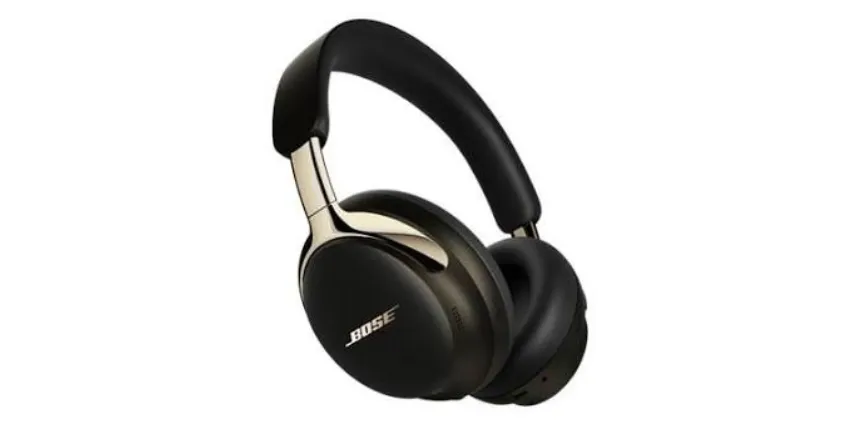 A pair of premium over-ear wireless headphones in black with metallic gold accents.