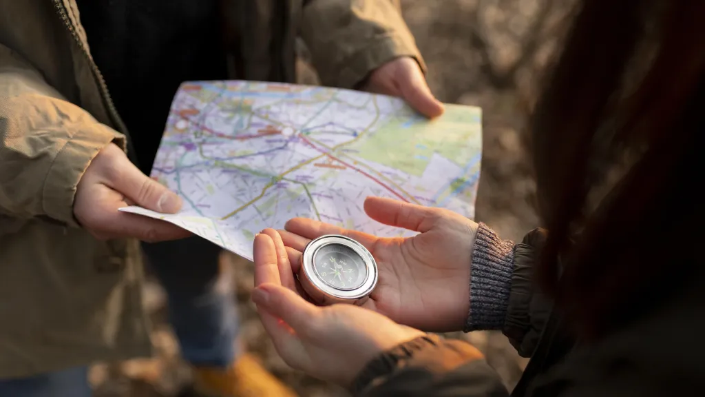 compass and map and good headphones for workout during hiking