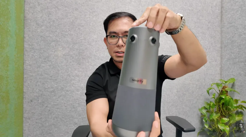 Tech reviewer Jeof demonstrating the Nearity 360 Alien conference room camera on camera.