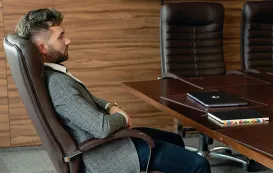 Brown lean forward chair