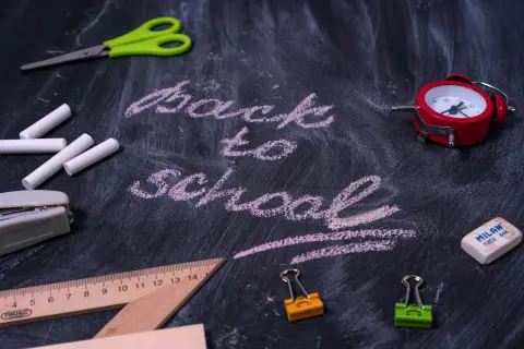 teacher uses traditional black board and chalks