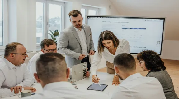 An office meeting is made more productive with  digital message boards
