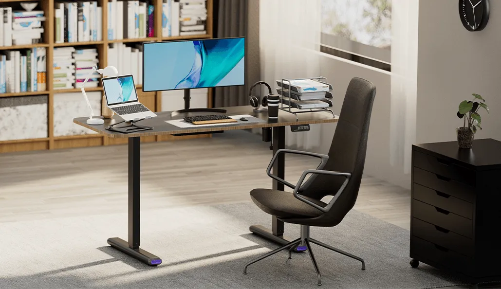Black electric sit to stand desk in home office