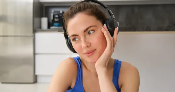 this woman is wearing headset with mute button