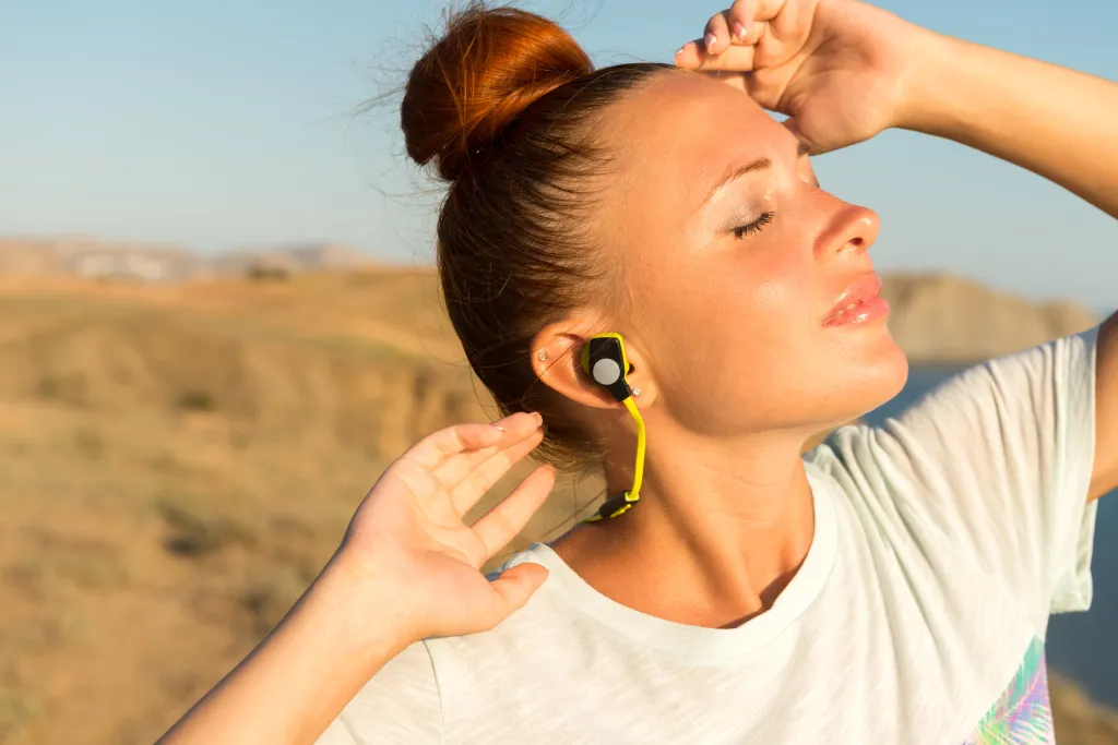 a fitness girl using best headset for phone calls