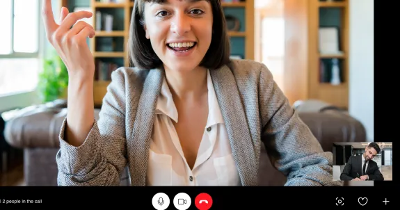 a woman and a man is holding a zoom meeting using best headphones for zoom meetings