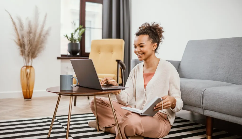 A woman is working from home.