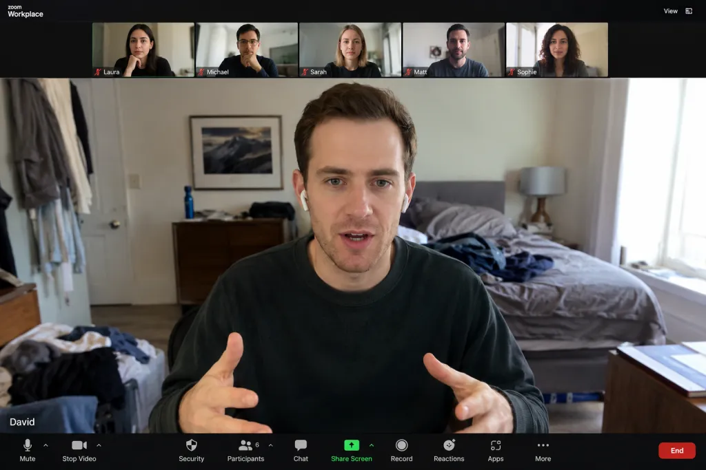Zoom meeting with a messy bedroom background before using background blur