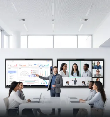 Des personnes debout devant un tableau intelligent interactif à écran tactile NearHub pour salles de réunion