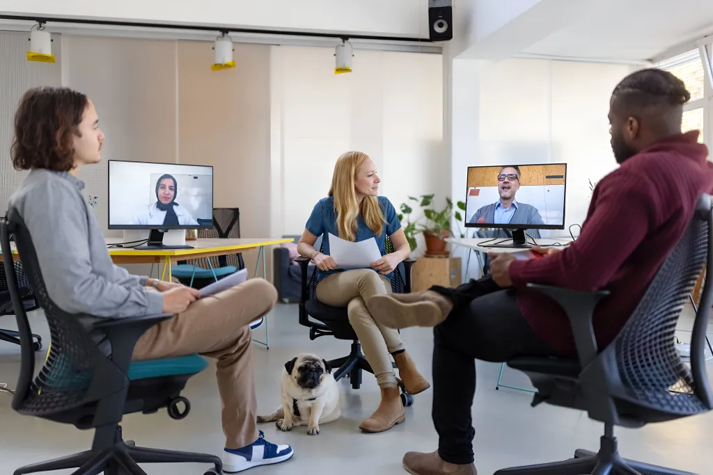 People in hybrid meeting.