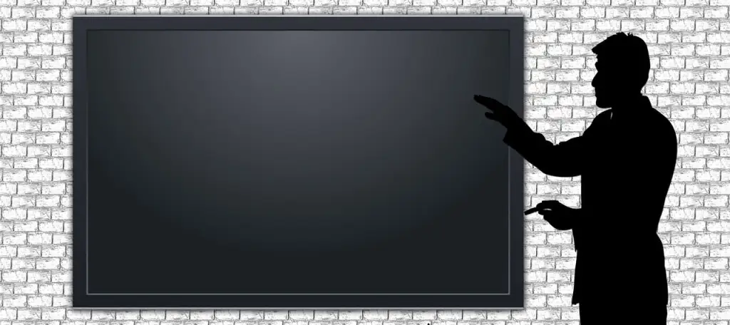 An instructor using an interactive whiteboard to play and annotate a video for a multimedia-rich lesson