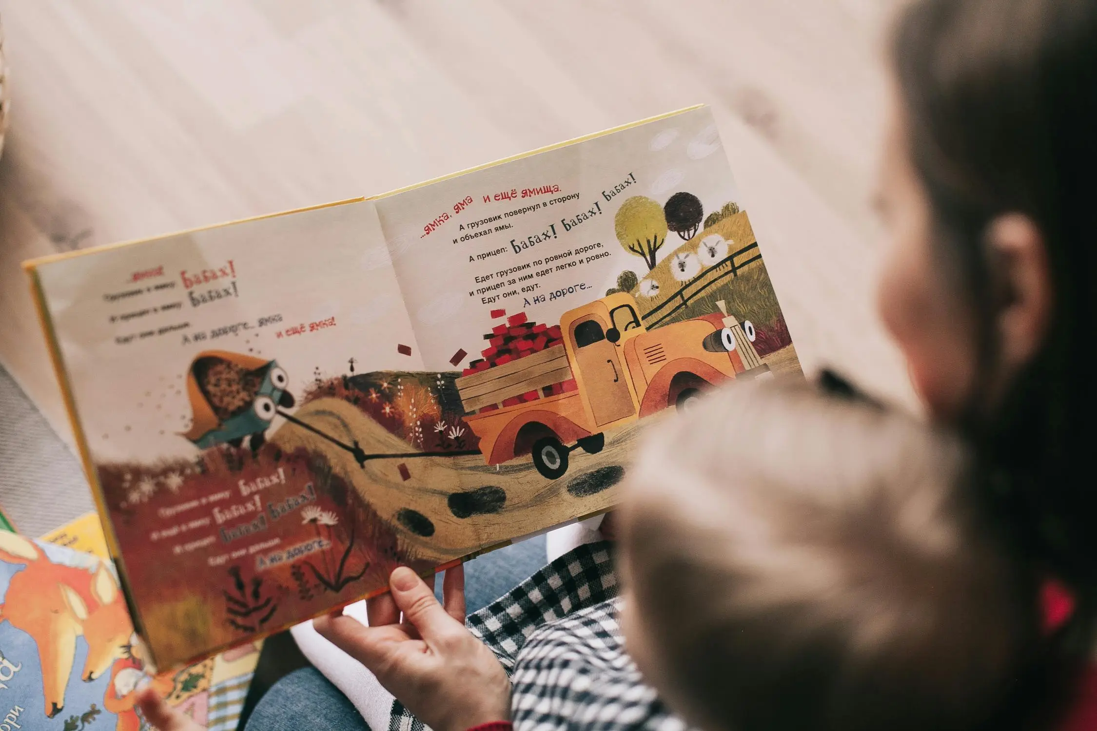 mother reading a book to her child