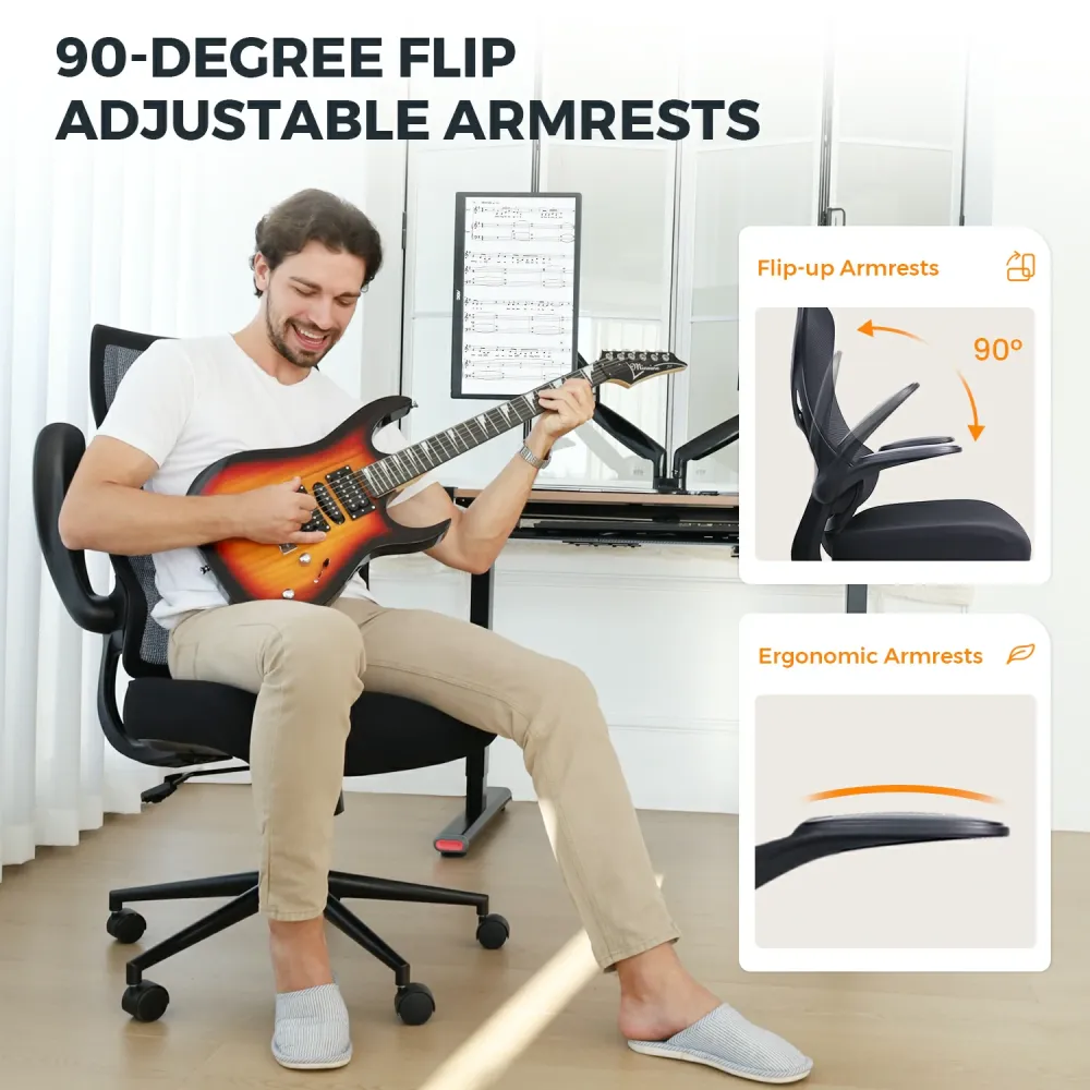A man sits on a short desk chair