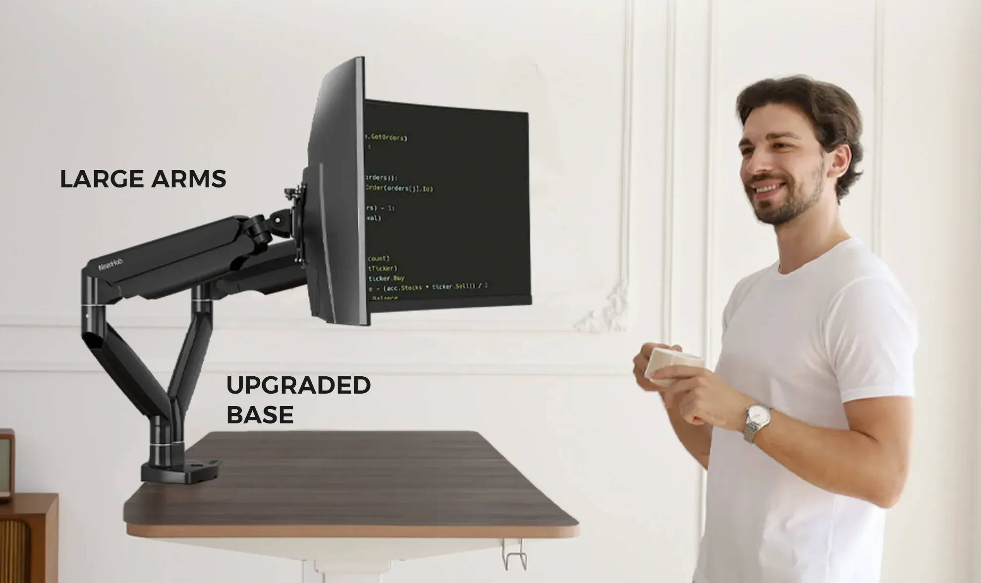 A man in front of NearHub Ergo two monitor desk stand MA40