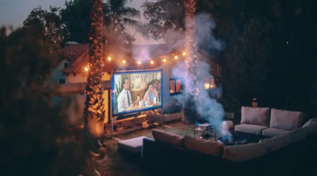 night projector in the outdoors which is below two coconut trees