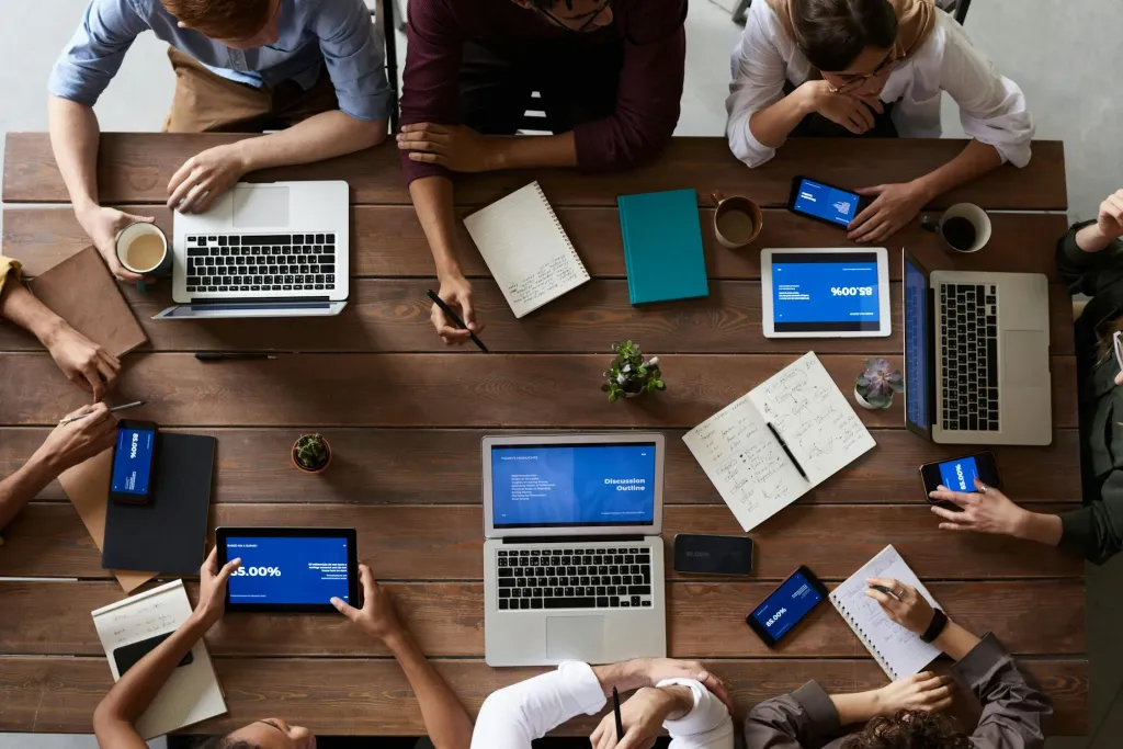 people working together around a wood table