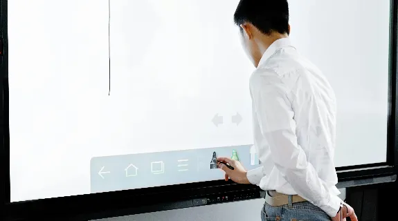 a teacher using notebook whiteboard
