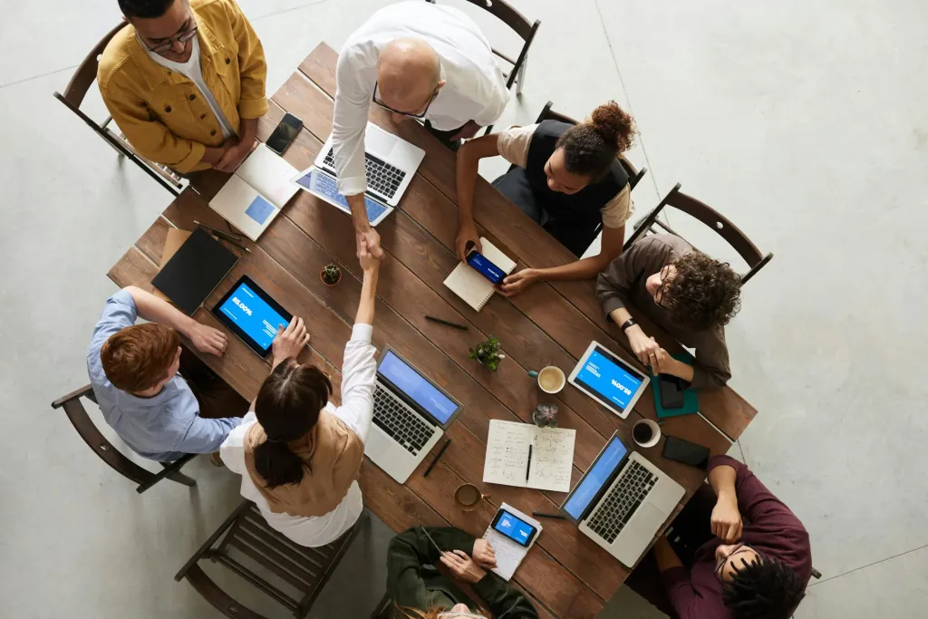 seven people working on a table