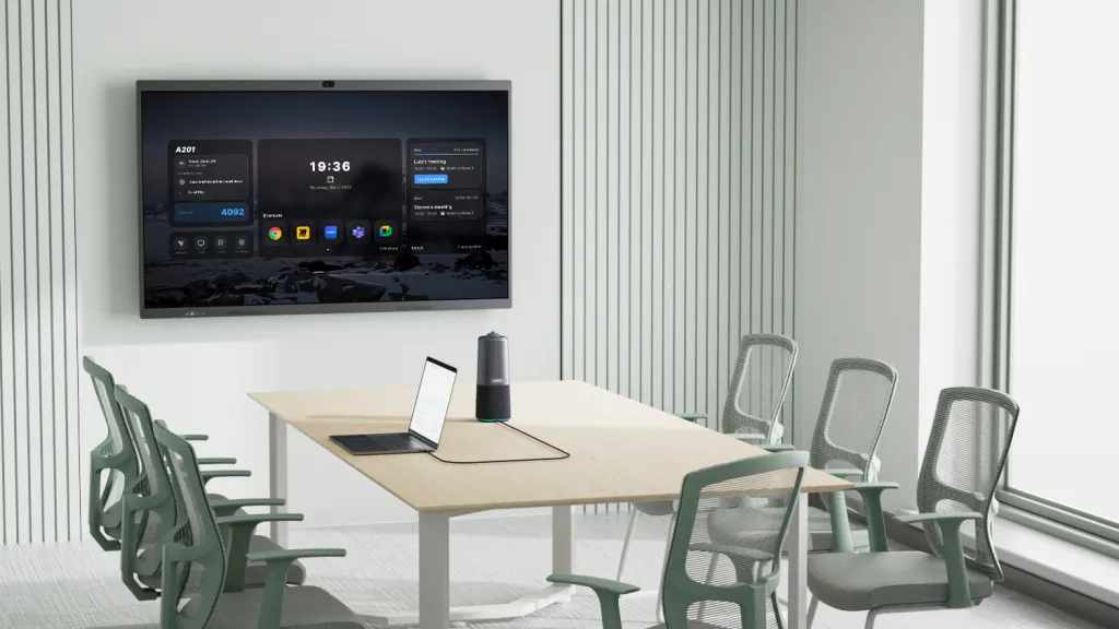 A fisheye conference camera in a small meeting room.