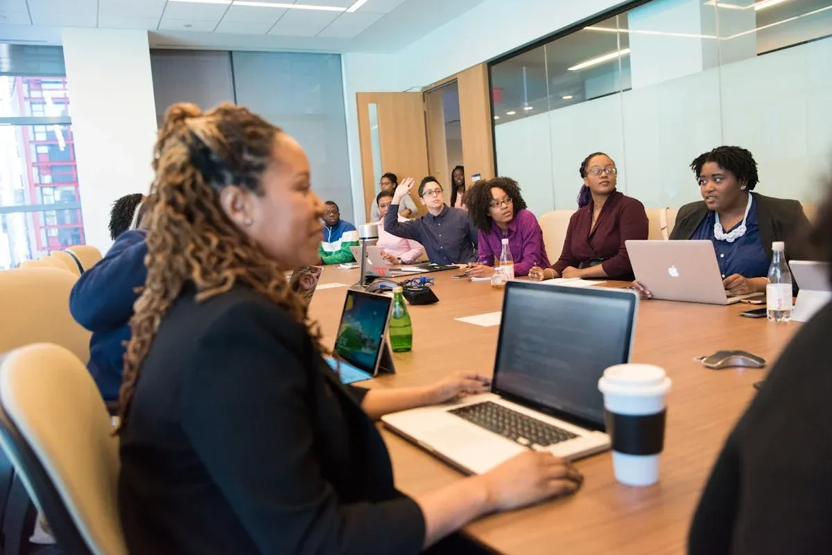 staff discuss something in the conference room.webp