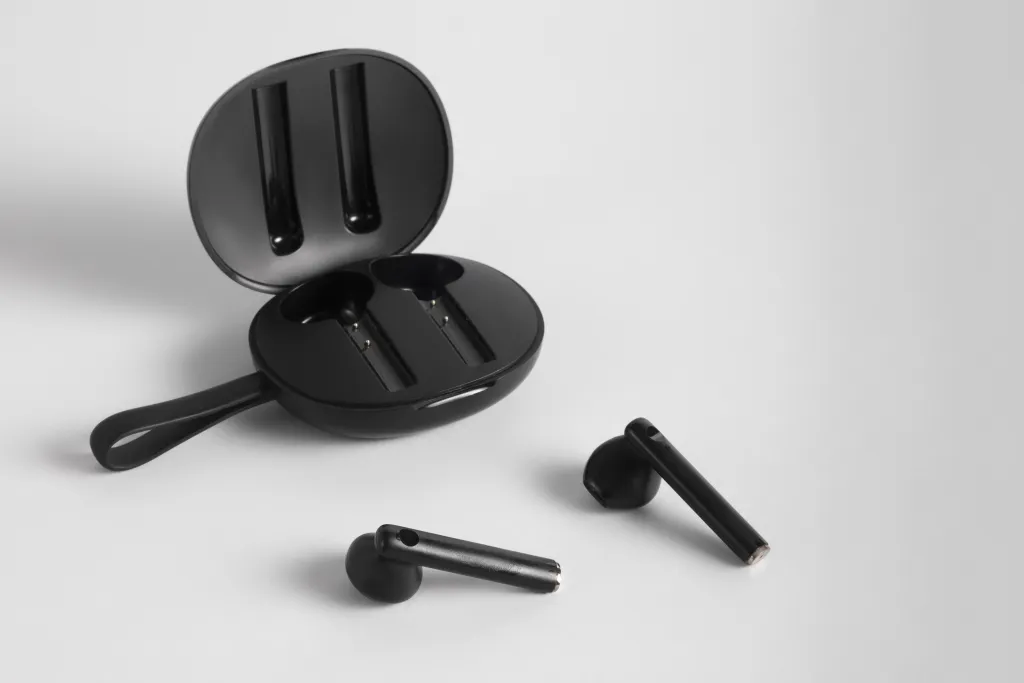 there is a white wireless earbuds for phone calls in the table