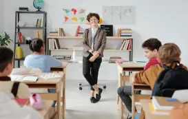 a team of students play whiteboard games