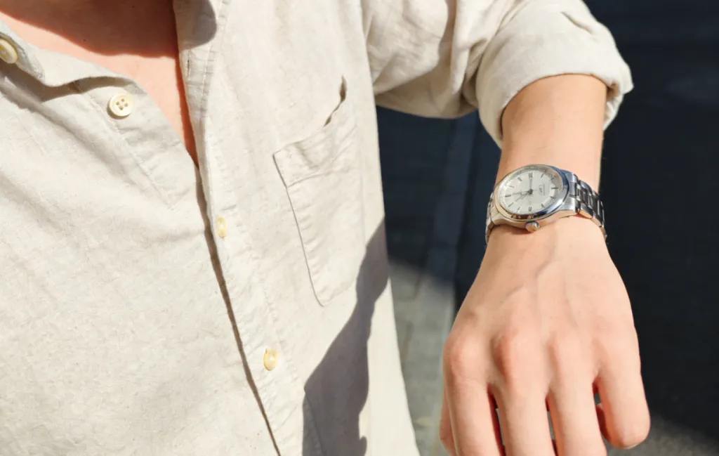 a man is wearing a watch