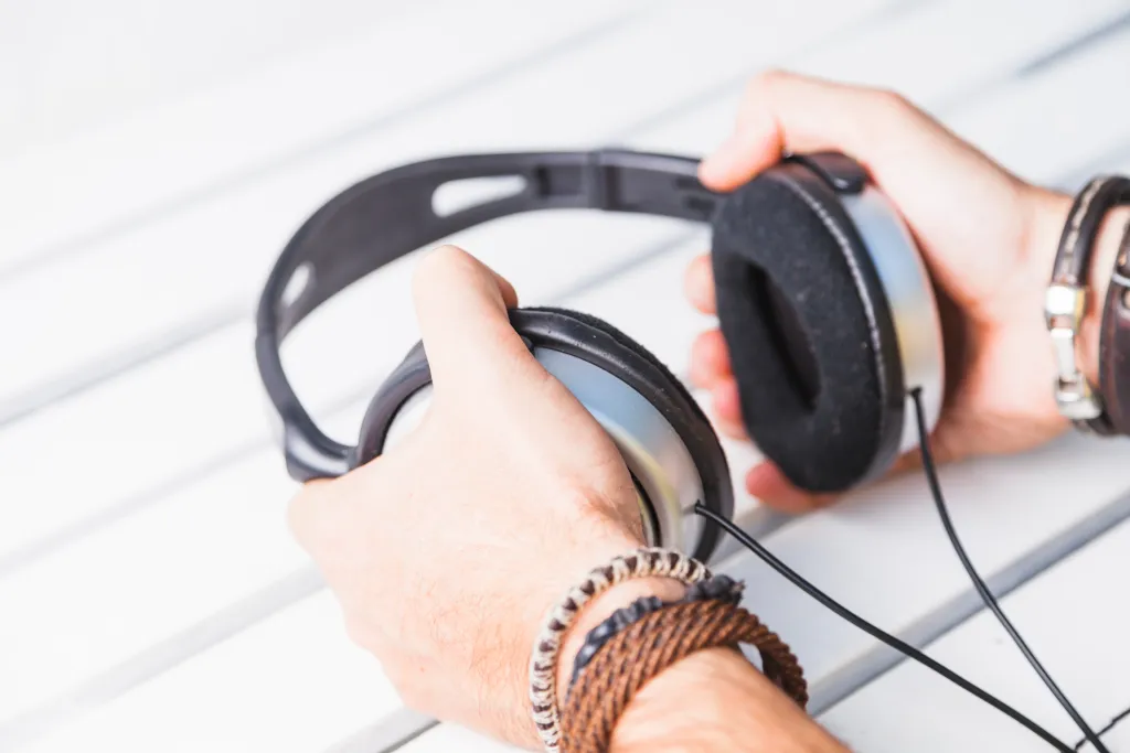 crop-hands-with-headphones