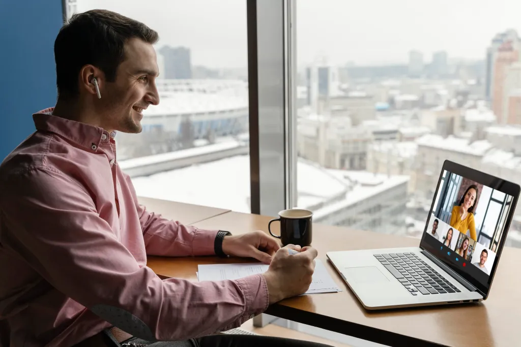 A man working remotely, attending online meetings and managing tasks from home.