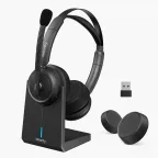 Nearity noise cancelling headphone with mic for office on its charging stand, with a USB dongle.